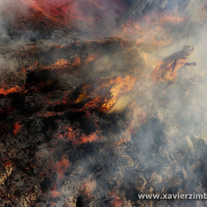 India, Man Walking On A Bonfire While Celebrating Holi, Festival Of Colours And Love In Spring