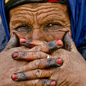 Close Up Portrait Of Elderly Nomadic Berber Woman With Hands Tattoo
