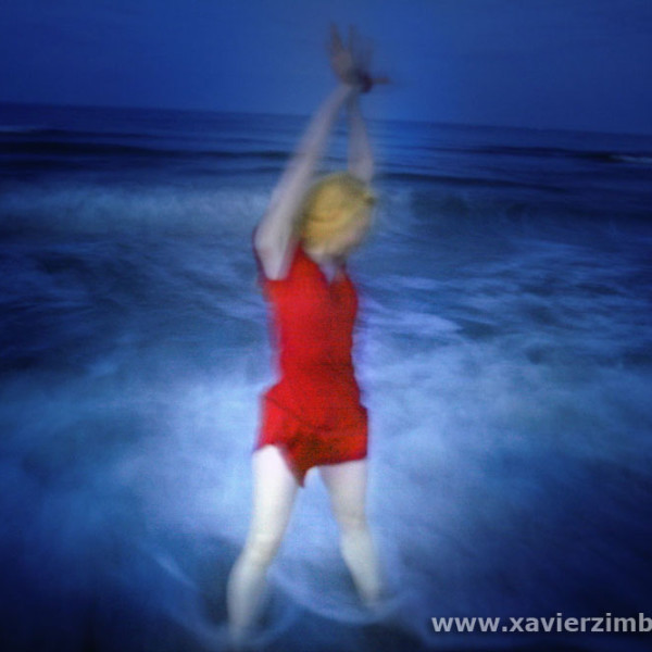 MALINKA IN THE WAVES DURING A FULL MOON NIGHT - ARLES BEACH - FR