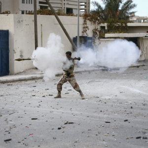 Libyan rebel fighter fires his RPG toward loyalist positions down town Sirte, Libya, Oct. 19