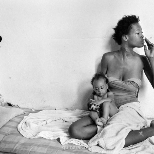 A single mother and a child in their apartment in Havana, Cuba.